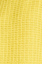 Close-up of a textured yellow fabric