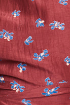 Red fabric with blue floral patterns