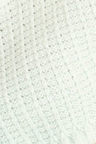 Close-up of a textured white fabric surface