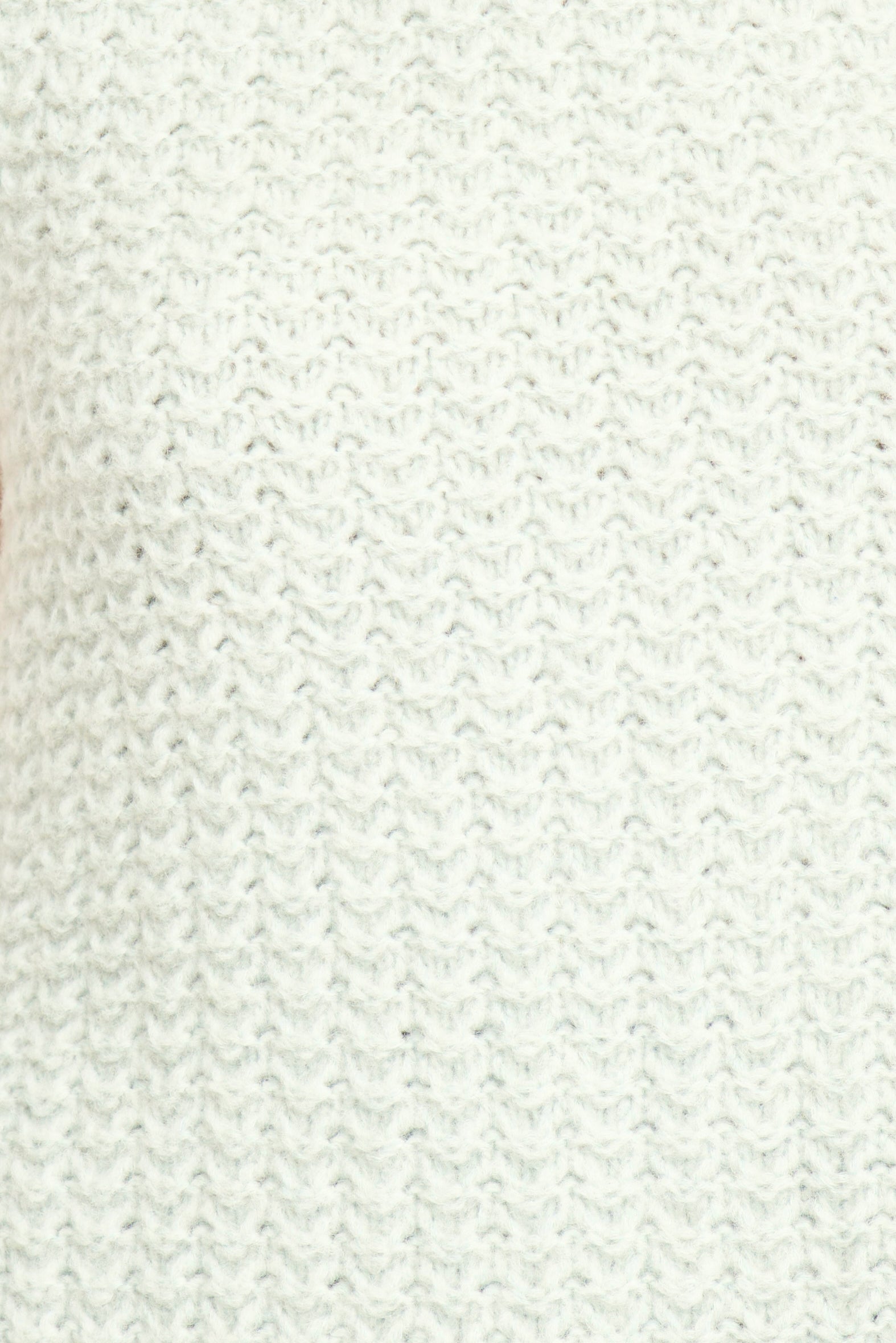 Close-up of a textured white fabric surface