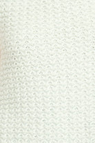Close-up of a textured white fabric surface