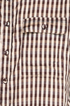 Close-up of a brown and white striped shirt with buttons.