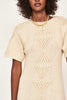 Girl wearing MIRTH women's knit short sleeve long resort sweater dress osaka in bone cream