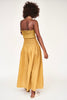 Girl wearing MIRTH women's smocked elastic savannah sleeveless cropped top set in yellow frost cotton