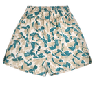 Girl wearing MIRTH women's wide leg elastic track shorts in plumeria blue floral print cotton