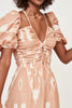 Girl wearing MIRTH women's v neck cutout spaghetti strap puff sleeve valencia long dress in peach conch ikat