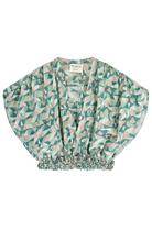 Girl wearing MIRTH women's smocked elastic waist cropped granada top set in seaglass green