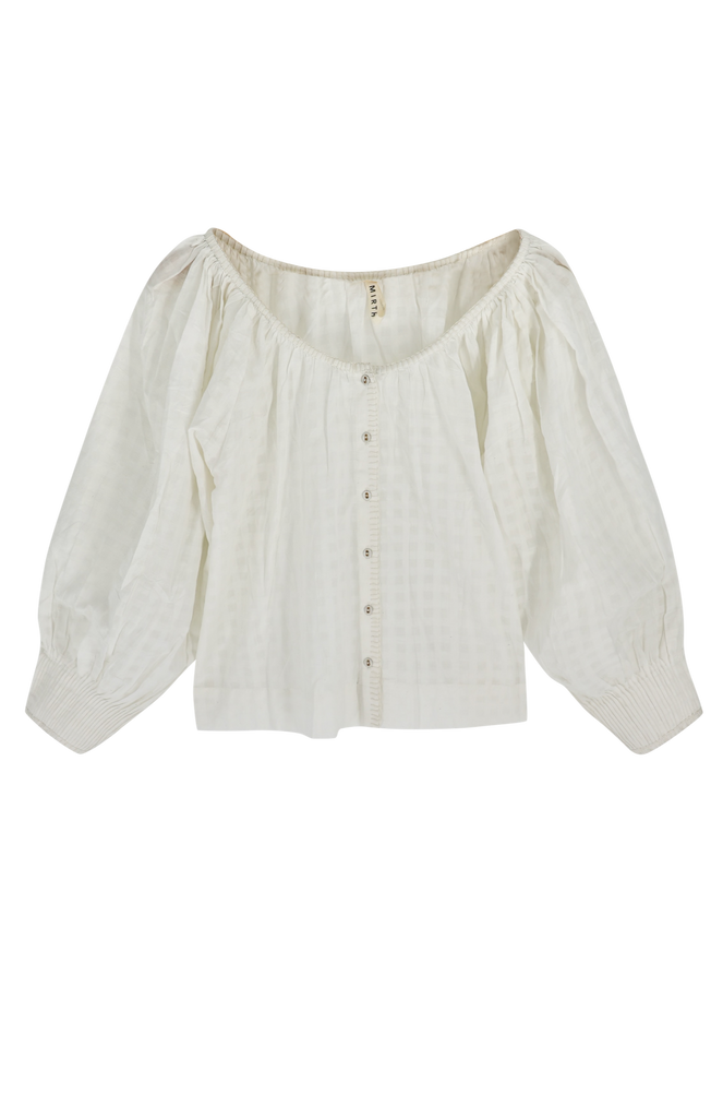 Girl wearing MIRTH women's pintucked long sleeve blouse seville top in white cotton
