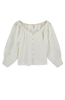 Girl wearing MIRTH women's pintucked long sleeve blouse seville top in white cotton