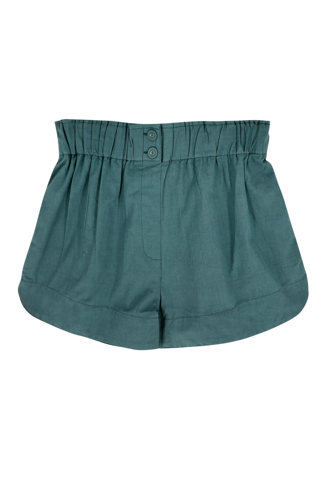 Girl wearing MIRTH women's wide leg elastic waist cotton track shorts in spruce green poplin