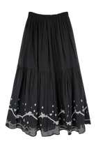 Girl wearing MIRTH women's long flowy paros skirt set in handloomed black carnival jamdani