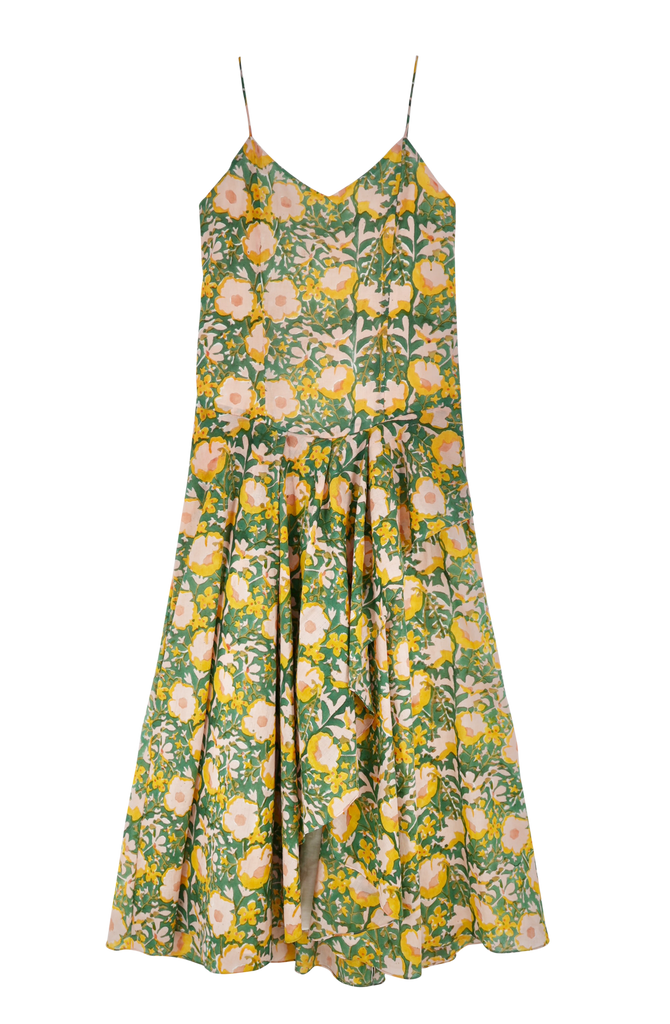 Girl wearing MIRTH women's long singapore spaghetti strap drop waist dress in camelia bloom green floral print cotton