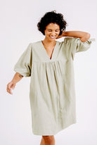 Girl wearing MIRTH women's balloon sleeve short" belem" vacation dress and coverup dress in sage green cotton