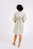 Girl wearing MIRTH women's balloon sleeve short" belem" vacation dress and coverup dress in sage green cotton