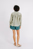 Girl wearing MIRTH women's buttoned long sleeve kerala pintucked blouse in sage green cotton