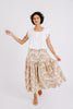 Girl wearing MIRTH women's long tiered bay skirt in snapdragon bloom pink floral print cotton