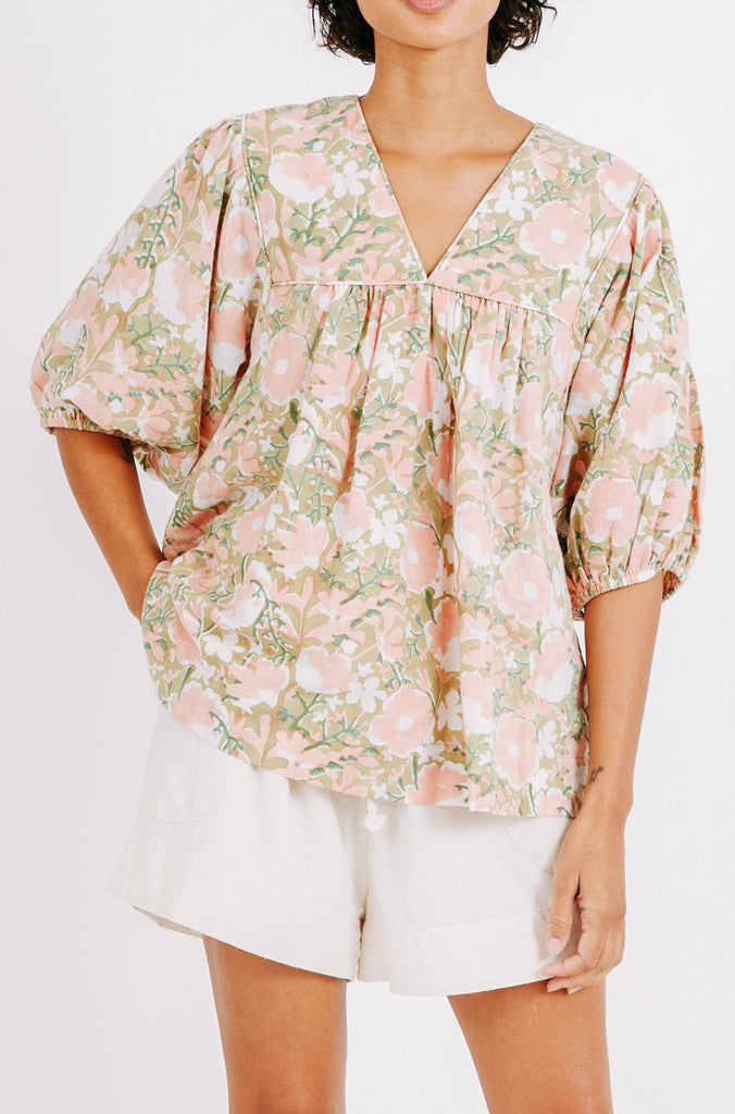 Girl wearing MIRTH women's balloon sleeve belem top in snapdragon bloom pink floral print cotton