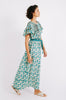 Girl wearing MIRTH women's long short sleeved scalloped vienna pintucked dress in seaglass green with back buttons and scalloped tie belt