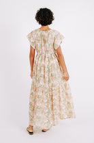 Girl wearing MIRTH women's long tiered short sleeve vienna maxi dress in snapdragon bloom pink floral print cotton