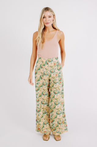 Girl wearing MIRTH women's high waist zip closure cotton tivot pant in rose bloom pink floral print