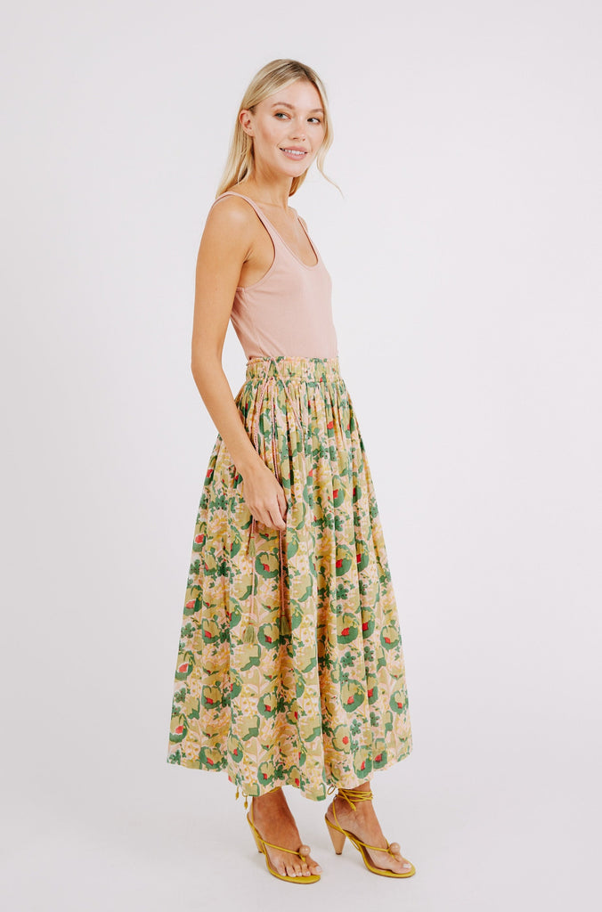 Girl wearing MIRTH women's flowy maxi verona cotton vacation skirt set in rose bloom pink floral print