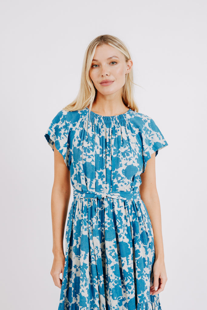 Girl wearing MIRTH women's long tiered short sleeve vienna maxi dress in indigo bloom blue cotton