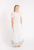 Girl wearing MIRTH women's long tiered short sleeve vienna maxi dress in white carnival handloomed cotton jamdani 