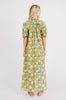 Girl wearing MIRTH women's long buttoned balloon sleeve somerset dress in camelia bloom green floral print cotton