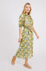 Girl wearing MIRTH women's long buttoned balloon sleeve somerset dress in camelia bloom green floral print cotton
