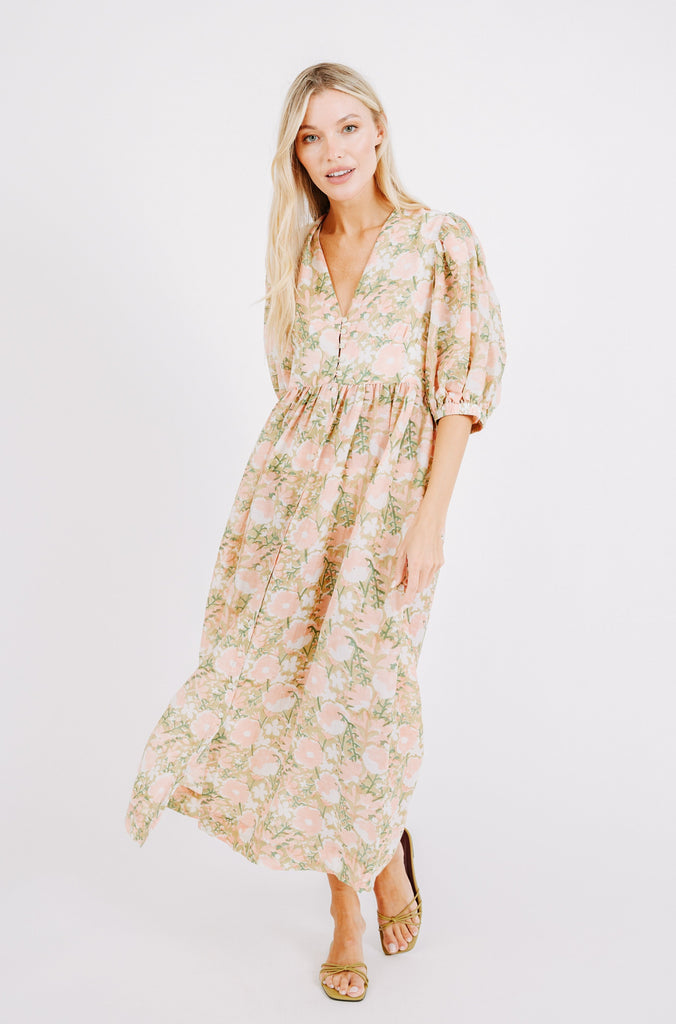 Girl wearing MIRTH women's long perth backless dress in snapdragon bloom pink floral print cotton silk