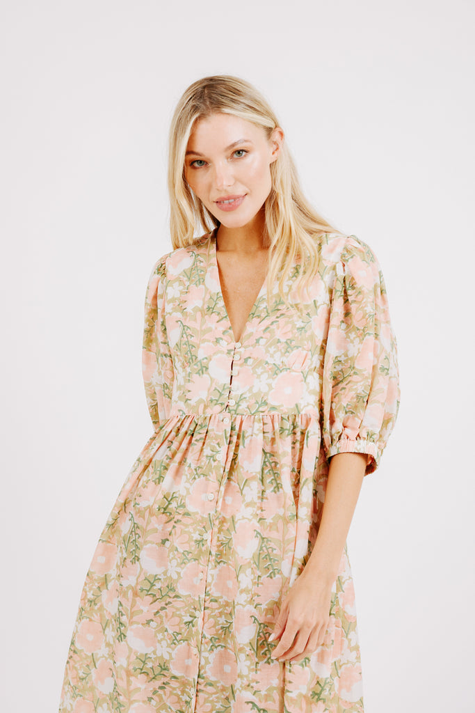Girl wearing MIRTH women's long perth backless dress in snapdragon bloom pink floral print cotton silk
