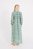 Girl wearing MIRTH women's long faro caftan dress in seaglass green