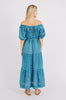 Girl wearing MIRTH women's long tiered short sleeve capri maxi dress in indigo rain blue cotton