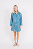Girl wearing MIRTH women's somerset short coverup dress in indigo rain blue cotton 