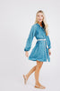 Girl wearing MIRTH women's somerset short coverup dress in indigo rain blue cotton 