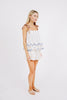 Girl wearing MIRTH women's sleeveless mykonos top with scalloped tie straps in white carnival handloomed cotton jamdani