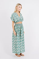 Girl wearing MIRTH women's smocked elastic waist cropped granada top set in seaglass green