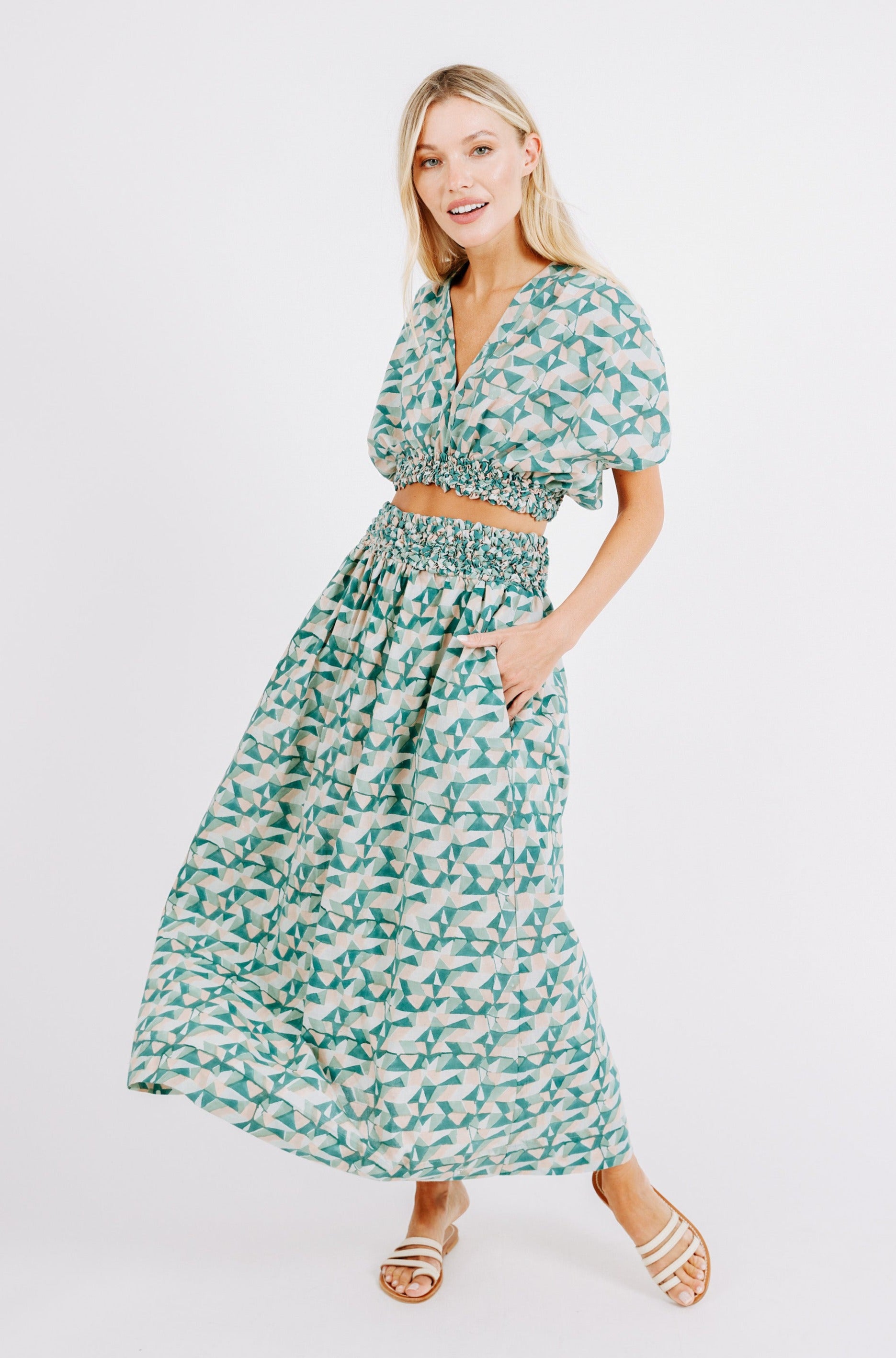 Girl wearing MIRTH women's smocked elastic waist cropped granada top set in seaglass green