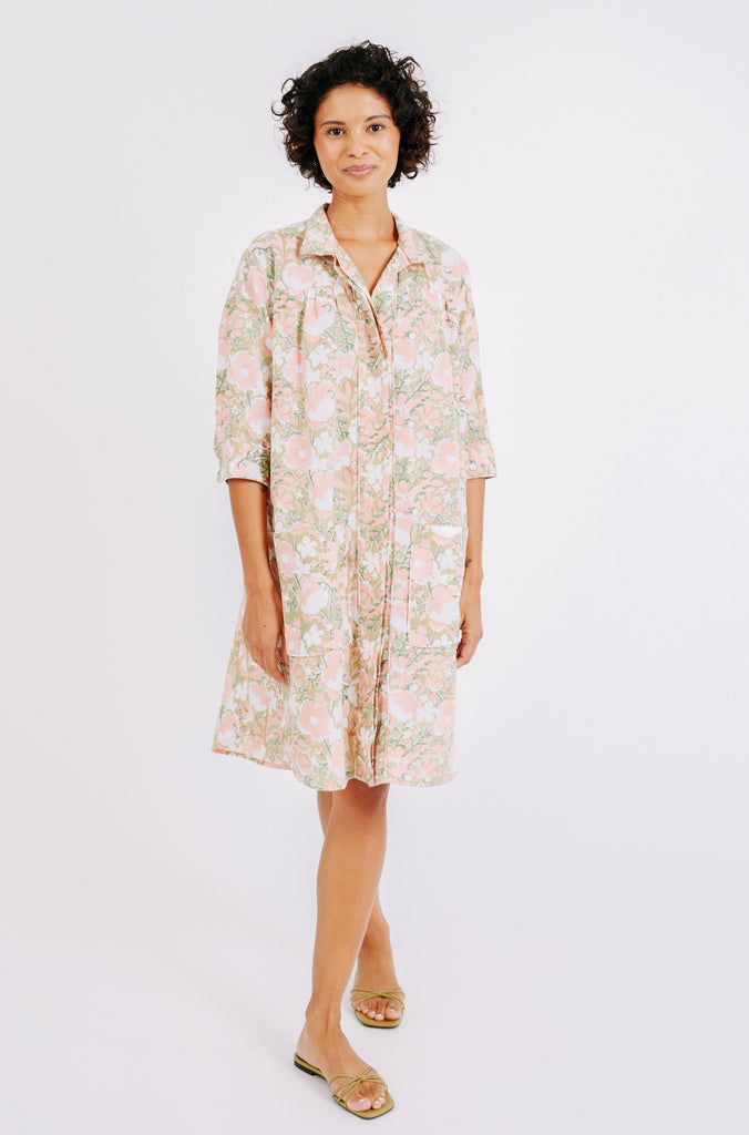 Girl wearing MIRTH women's short buttoned marfa shirt dress in snapdragon bloom pink floral print cotton