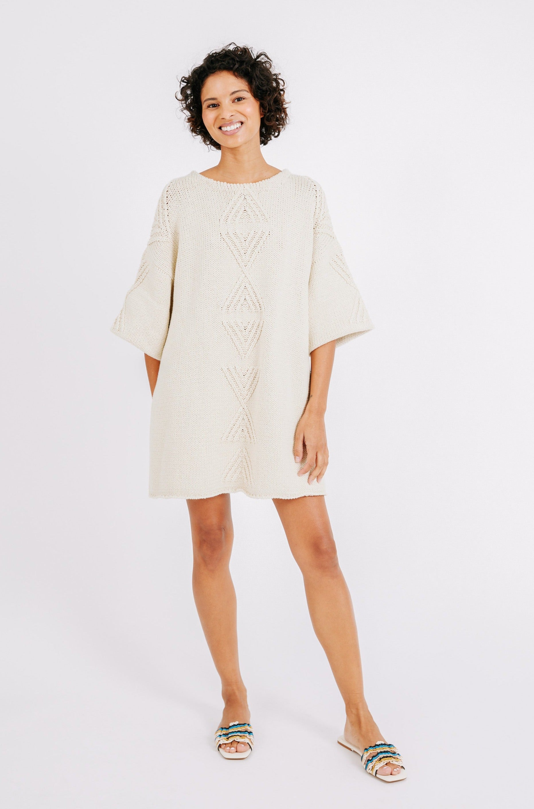 Girl wearing MIRTH women's knit short Osaka sweater dress in bone cream