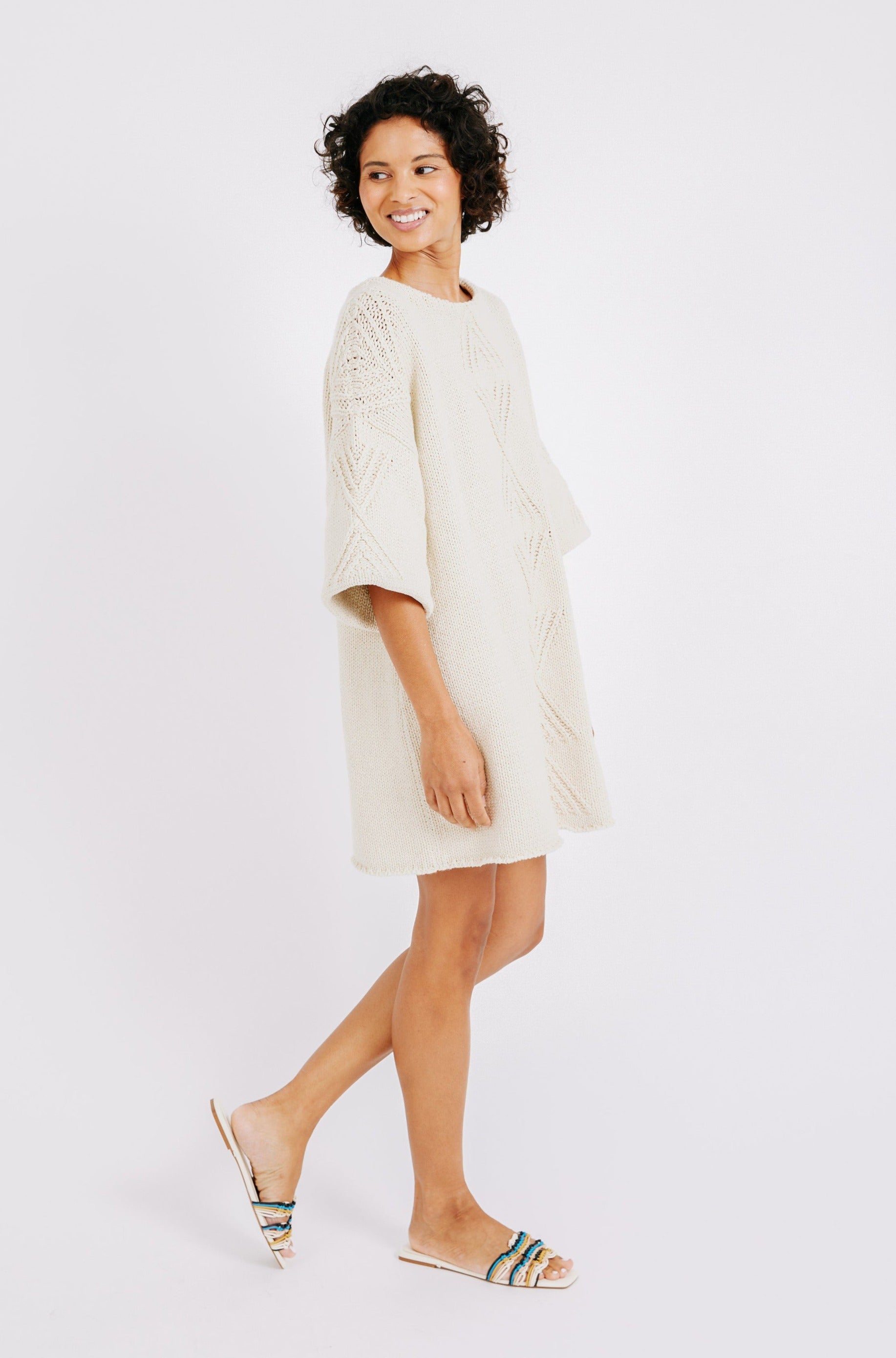 Girl wearing MIRTH women's knit short Osaka sweater dress in bone cream