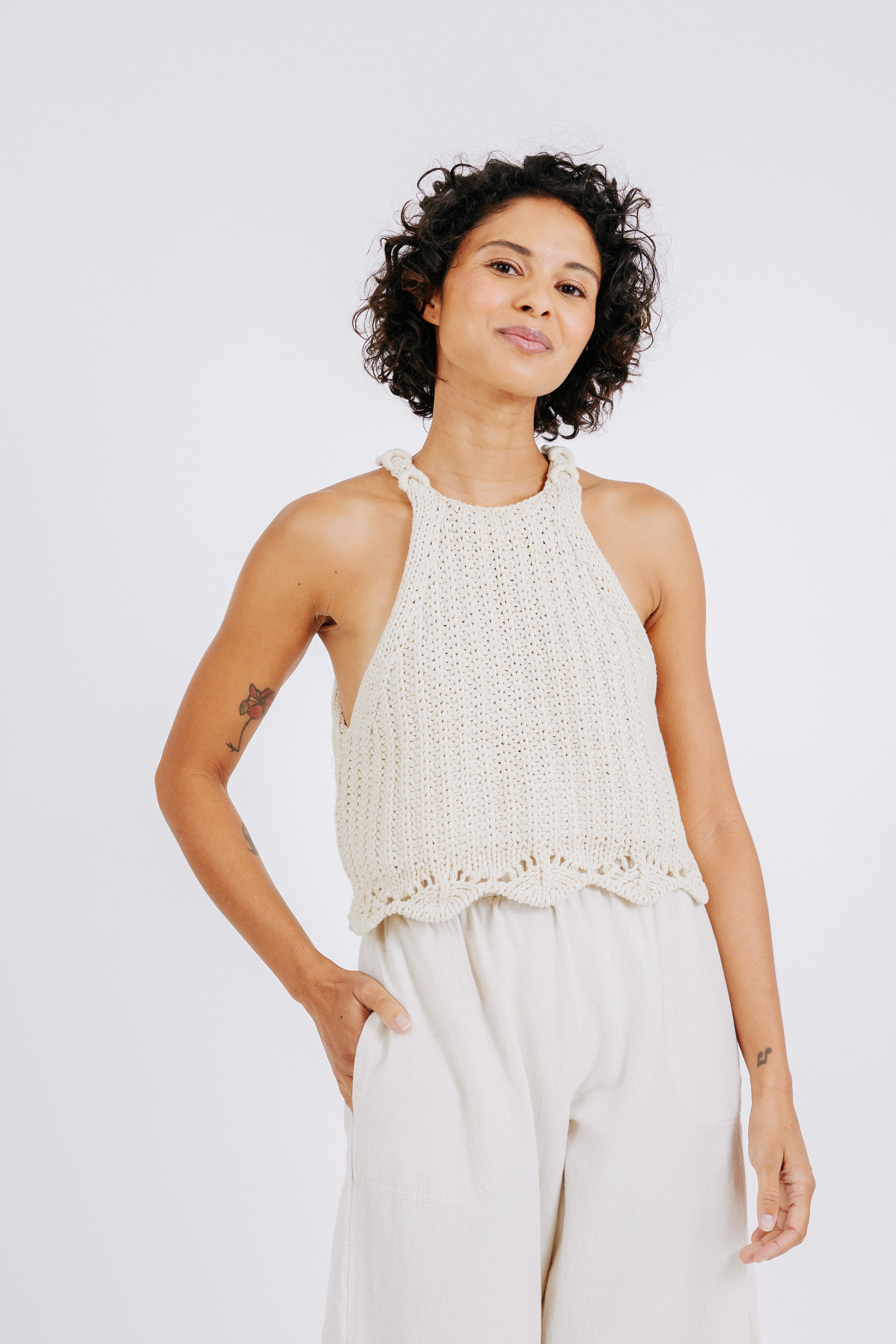 Girl wearing MIRTH women's knit sleevless borocay tank top coverup in bone cream