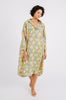 Girl wearing MIRTH women's buttoned kyoto midi house dress in camelia bloom green floral print cotton 