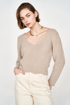 Girl wearing MIRTH women's knit v neck bellagio sweater in taupe brown wool