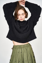 Girl wearing MIRTH women's knit cusco pullover sweater in black wool