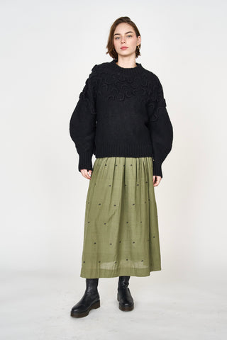 Girl wearing MIRTH women's knit cusco pullover sweater in black wool