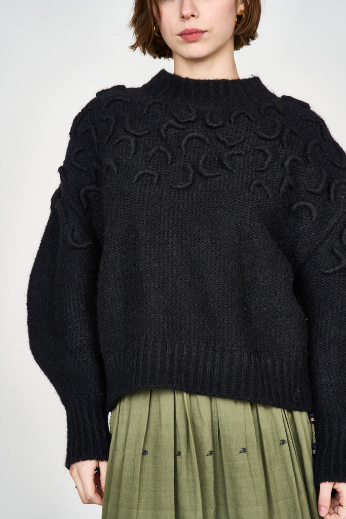 Girl wearing MIRTH women's knit cusco pullover sweater in black wool