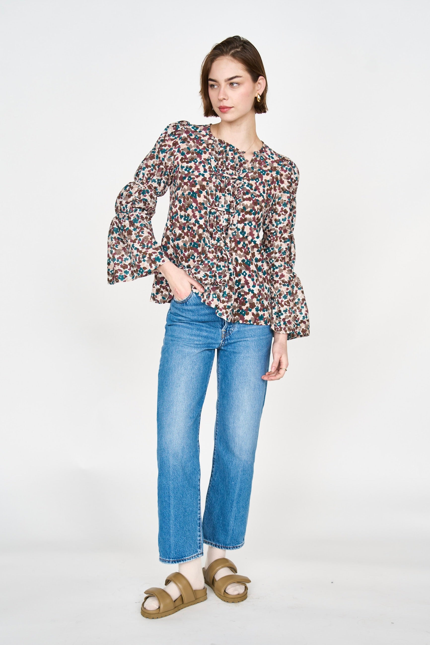 Girl wearing MIRTH women's elastic tier long sleeve fez blouse in purple brown amaryllis silk