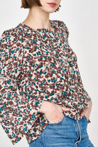 Girl wearing MIRTH women's elastic tier long sleeve fez blouse in purple brown amaryllis silk