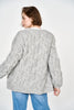 Girl wearing MIRTH women's handknit cortina cable cardigan sweater in dove grey wool
